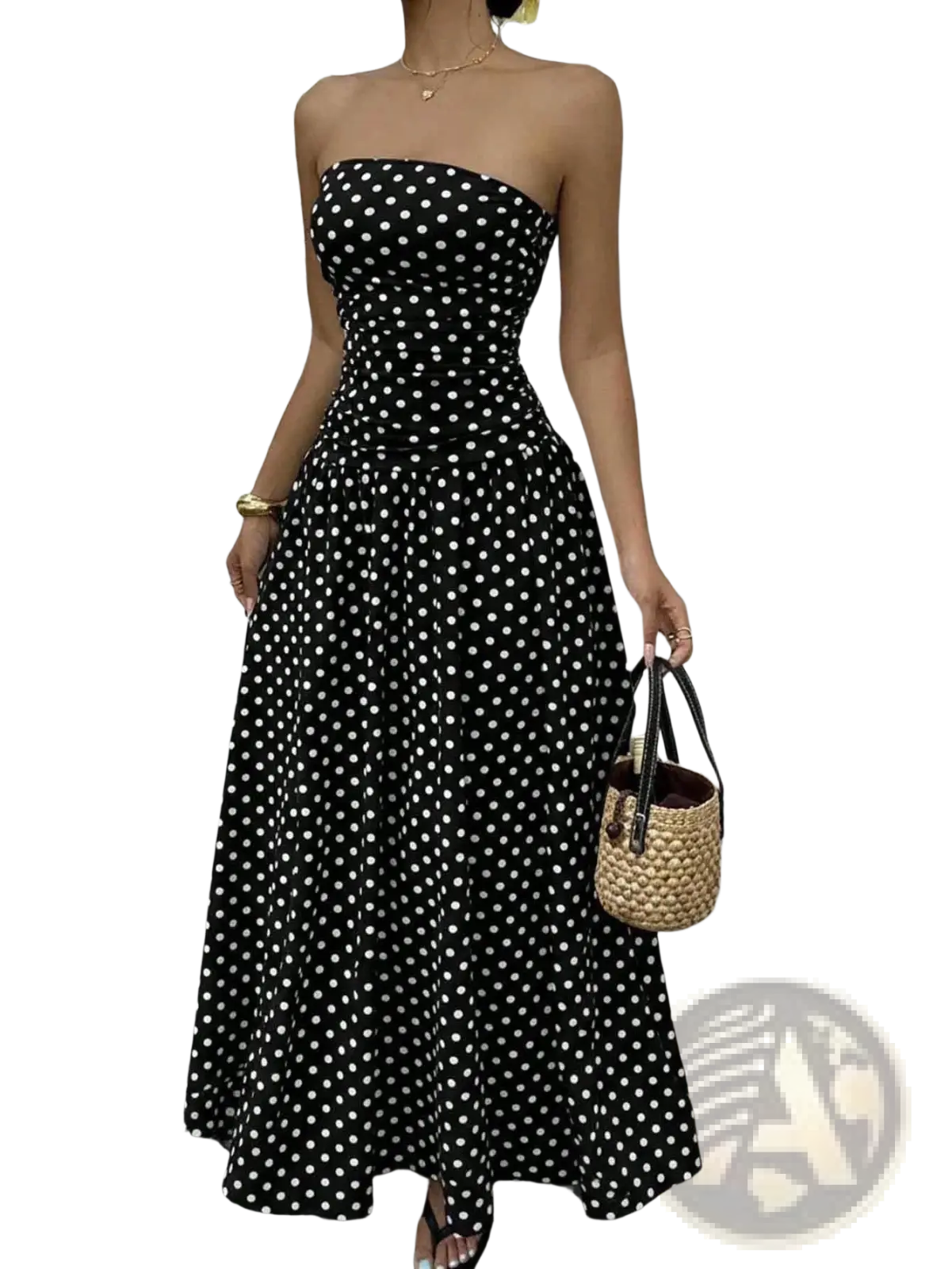 Black strapless maxi dress with white polka dots featuring an off shoulder design and lightweight fabric for summer wear