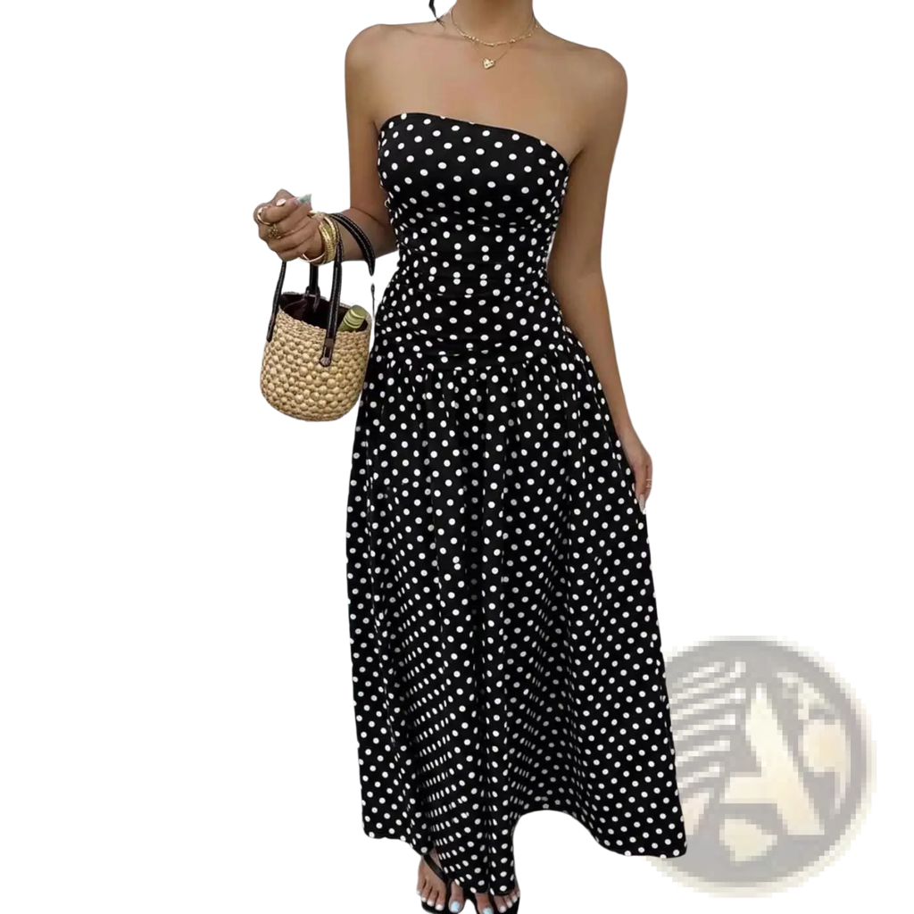 Black strapless maxi dress with white polka dots featuring an off shoulder design for elegant occasions