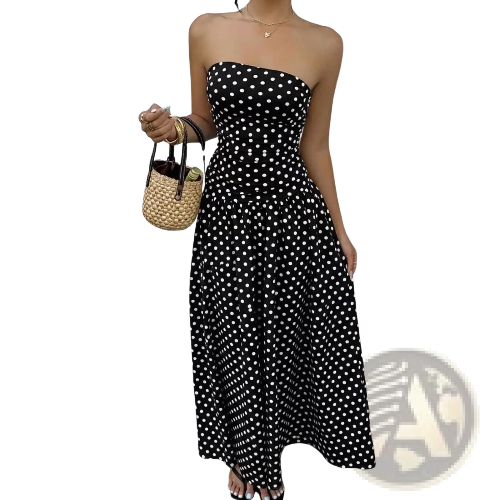 Black strapless maxi dress with white polka dots featuring an off shoulder design for elegant occasions