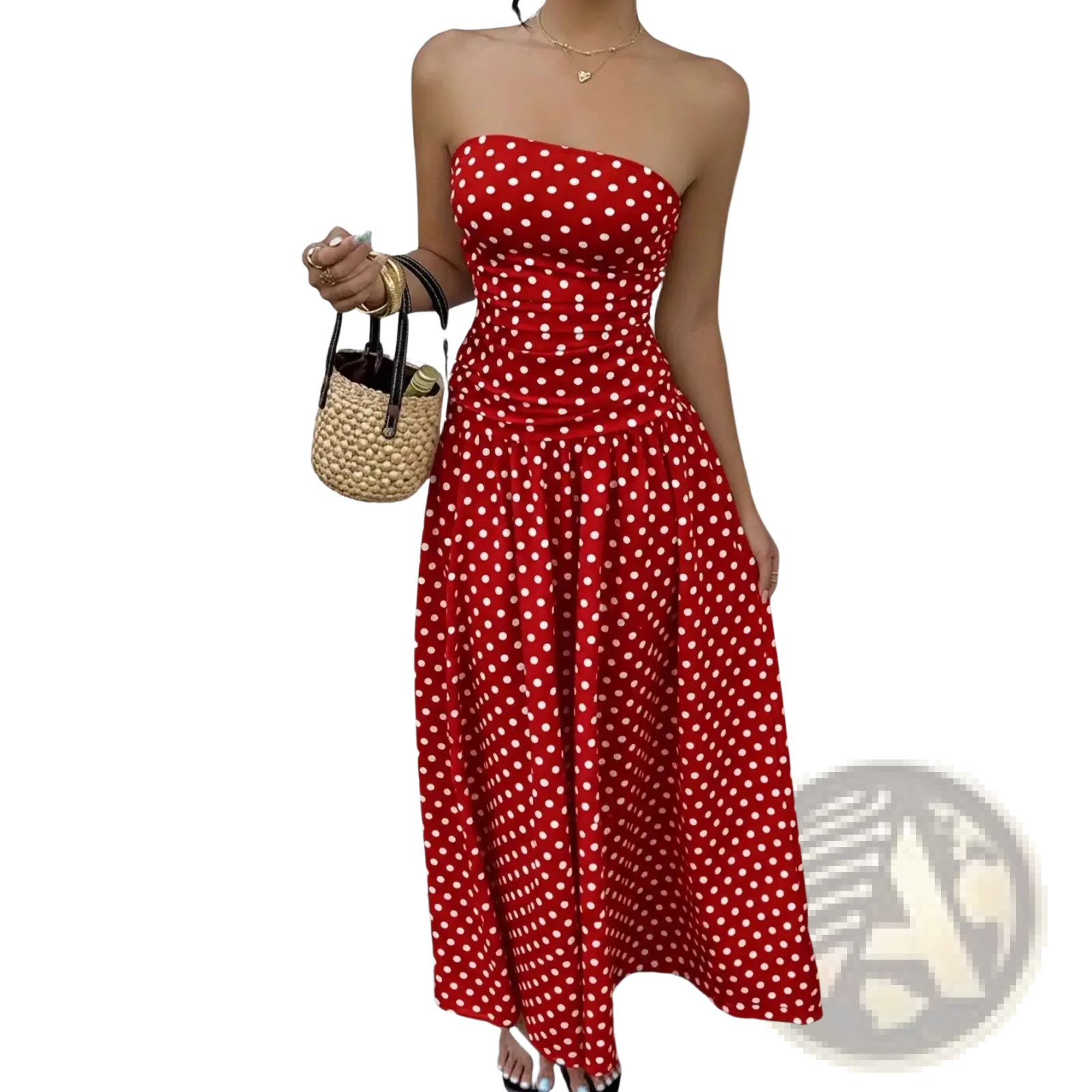 A vibrant red strapless maxi dress with white polka dots made from flowing fabric perfect for summer wear