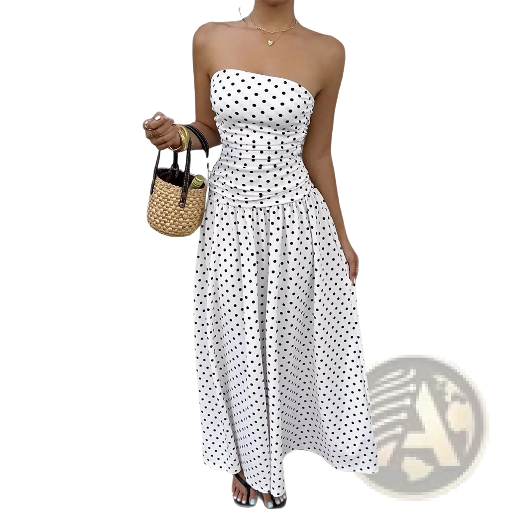 White strapless maxi dress with black polka dots and ruched waist suitable for elegant occasions