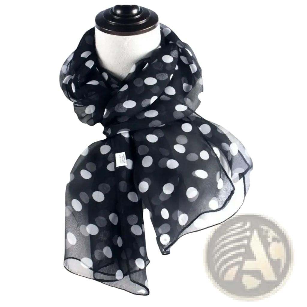 Black sheer silk head wrap scarf with white polka dots draped around a mannequin neck for stylish wear