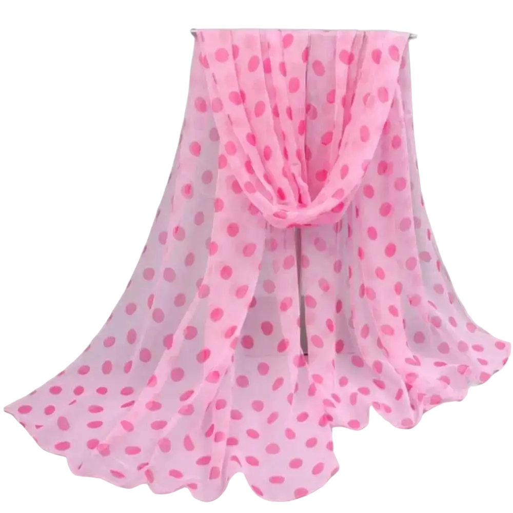 A delicate pink polka dot chiffon silk head wrap scarf with a soft flowing drape
