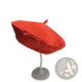 Red polka dot fabric beret with a small loop on top for sun protection in a baseball cap style