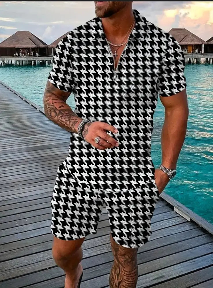 Men’s geometric pattern polo and shorts performance set featuring black and white houndstooth patterned short-sleeved romper