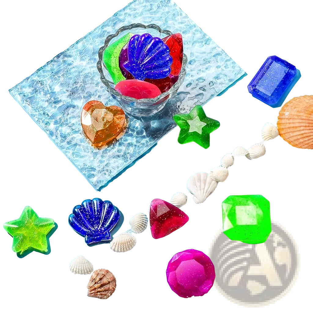 Colorful glittery seashell and gemstone shaped soap bars on sand with small shells in pool dive toys training set