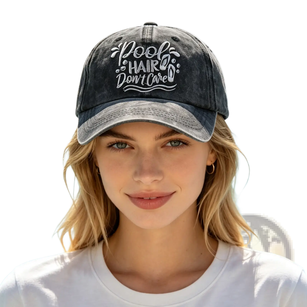 A faded black vintage baseball cap with white embroidered text pool hair dont care on the front panel