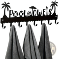 Black metal pool towel rack wall mounted with 8 hooks and palm tree beach-themed cutouts spelling pool towels