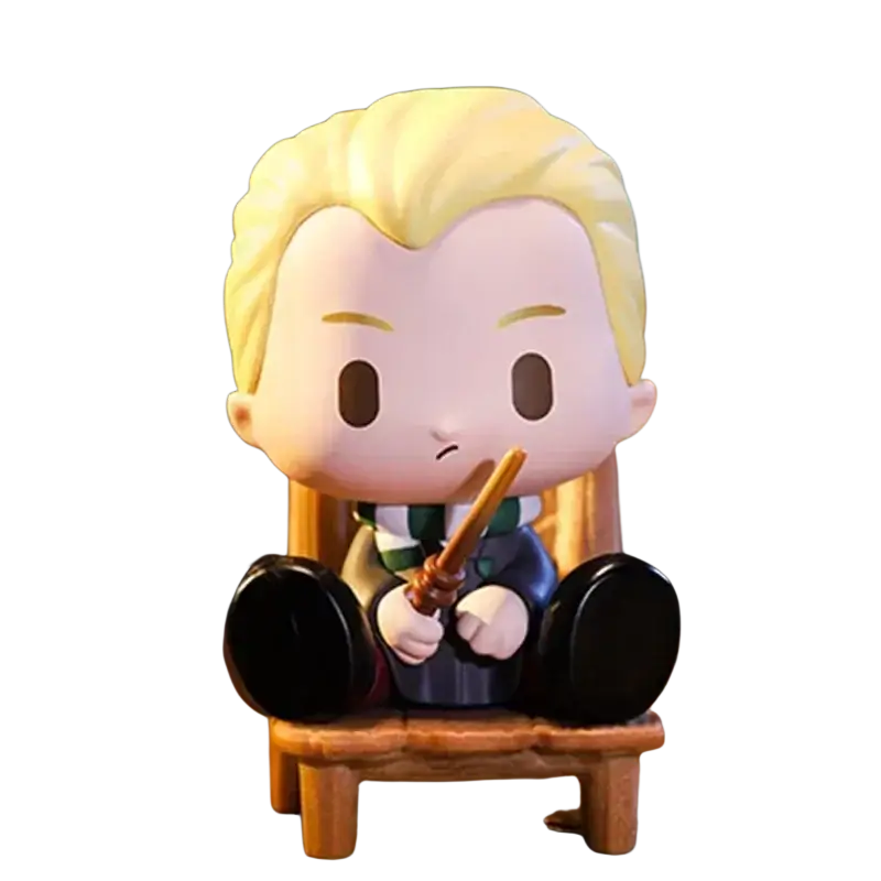 Chibi-style draco malfoy figurine with blonde hair and green silver scarf seated holding wand from pop mart blind box actual product