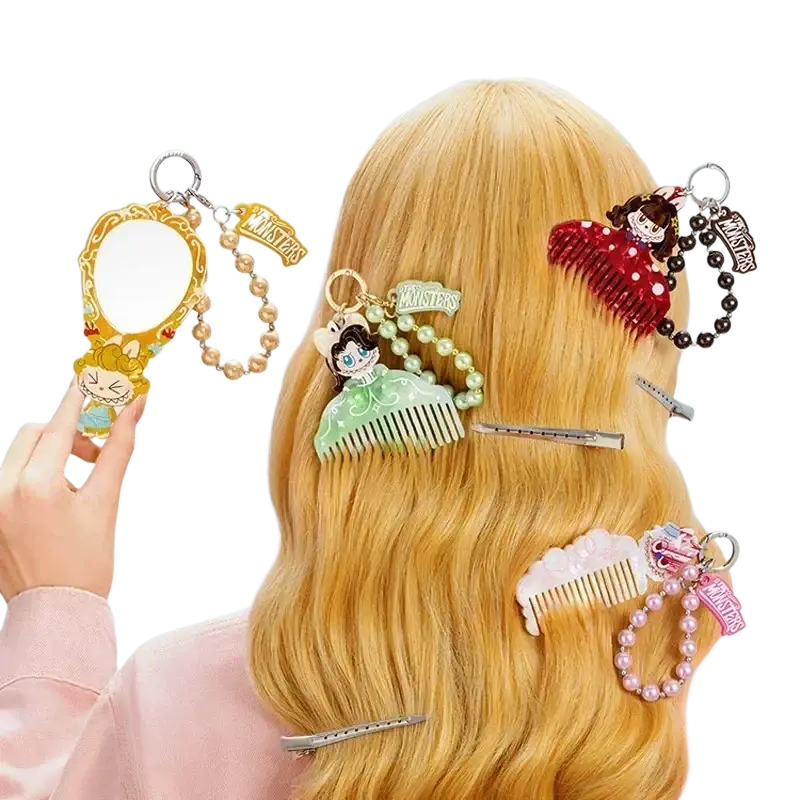 A gold-framed miniature mirror with cartoon design and pearl chain from pop mart labuub the monsters guess bag