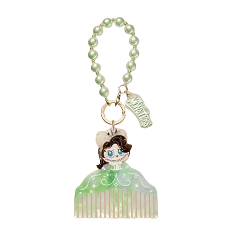 A mint-green translucent acrylic comb-shaped keychain featuring a cartoon character from pop mart guess bag