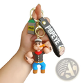 Popeye silicone keychain featuring a molded plastic figure in classic outfit with blue pants and orange shoes