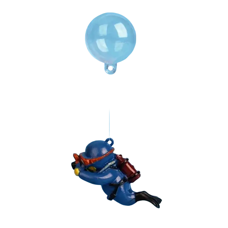 Blue plastic diver figurine with red and black accents floating beneath a clear balloon in aquarium decoration