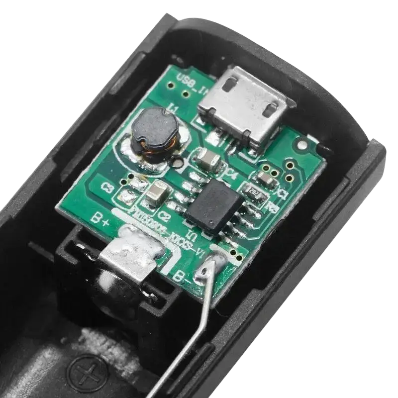Black plastic usb charging adapter with green circuit board and silver usb ports for portable 18650 power bank case