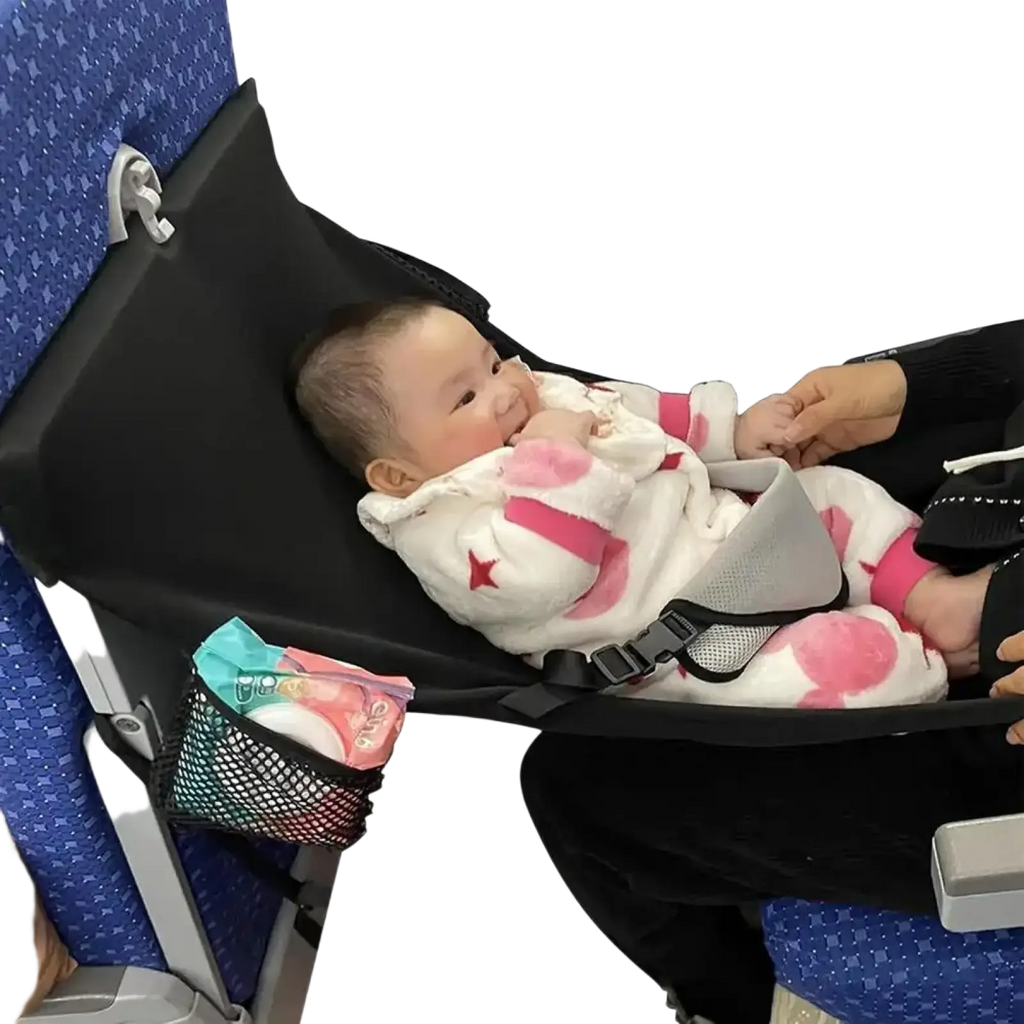 Black portable airplane bed for kids and toddlers with mesh side pocket and foot rest shown from the back side