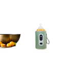 A mint-green portable bottle warmer with digital display and white handle snugly encases an orange baby bottle