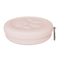 Portable dog travel bowl with treat storage in soft pink silicone featuring a molded paw print and silver carabiner clip