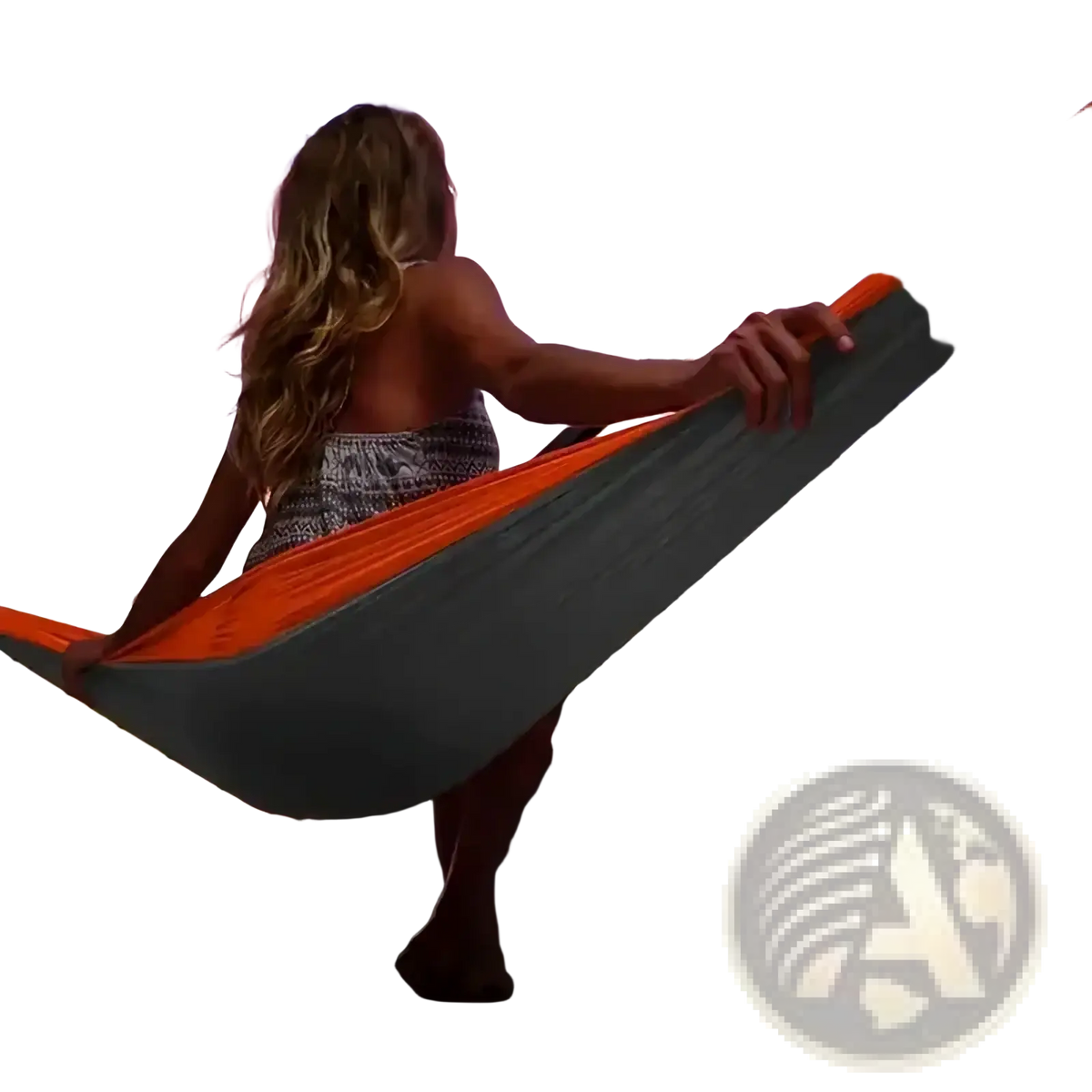 Portable double camping hammock in orange and gray suspended between railings for outdoor relaxation