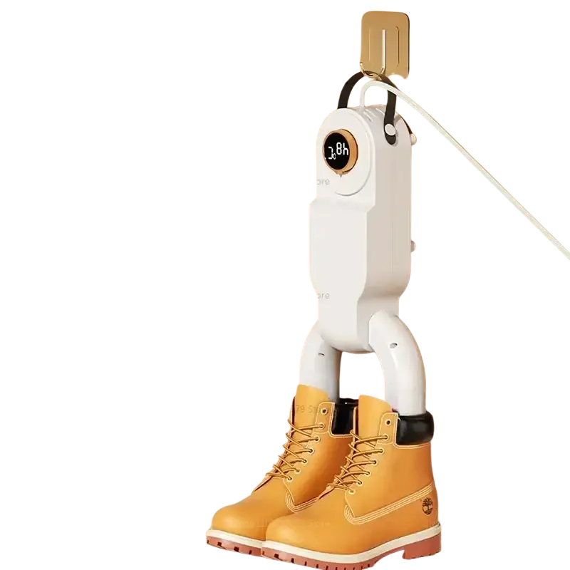 White portable electric shoe dryer and warmer with digital display and black accents drying tan timberland boots mounted on wall