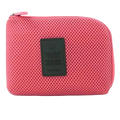 Portable electronic cable travel organizer bag in pink mesh with a dark green leather patch for easy storage