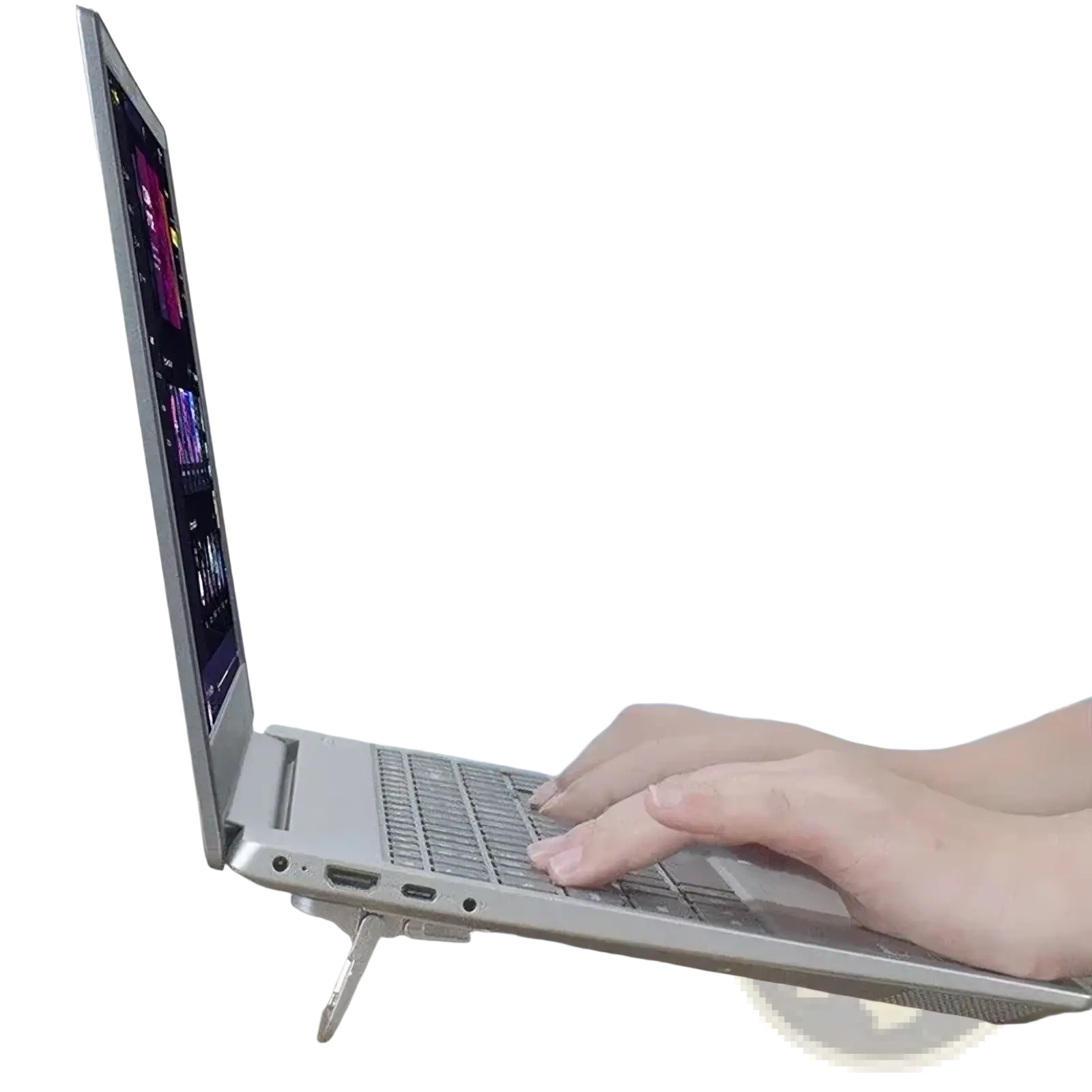 Silver laptop on a sleek portable laptop stand footrest suspension base displaying colorful video editing software