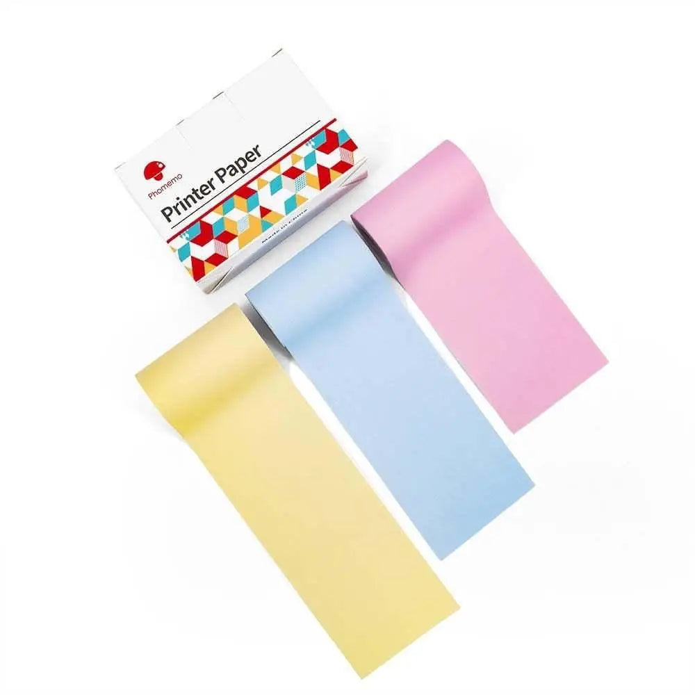 Three rolls of phoenemo brand pastel yellow light blue and pink printer paper for portable bluetooth mini thermal label printer