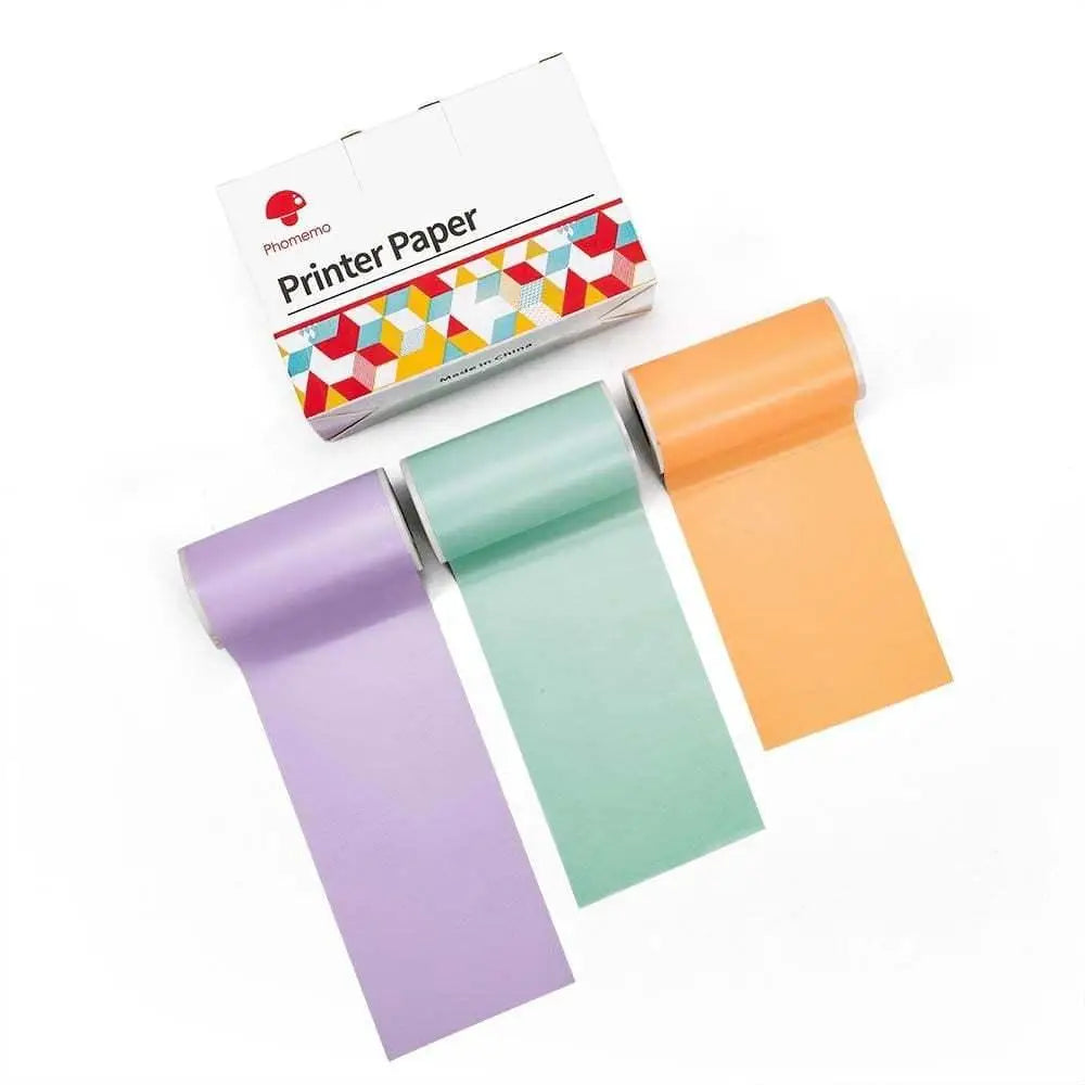 Three rolls of colorful matte finish printer paper in lavender mint green and orange for portable bluetooth mini thermal printer