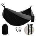 Black and gray two-tone nylon portable camping hammock with attached carabiners, ropes, and drawstring carry bag