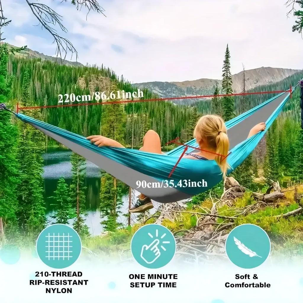 Teal and gray two-tone portable nylon camping hammock with rip-resistant fabric and tree straps for outdoor use