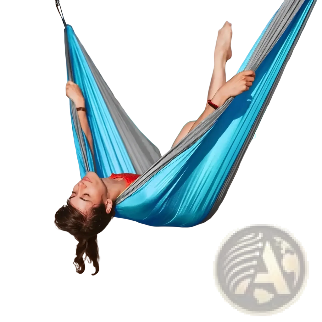 A vibrant blue and gray portable nylon camping hammock made of soft silk-like material with tree straps
