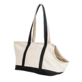 Beige canvas portable pet tote bag with black fabric handles and trim for home business store or business store outdoor use