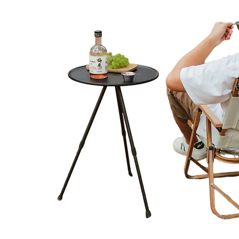 Black portable picnic camping table with round aluminum top and slender tripod legs camping table adjustable for outdoor use