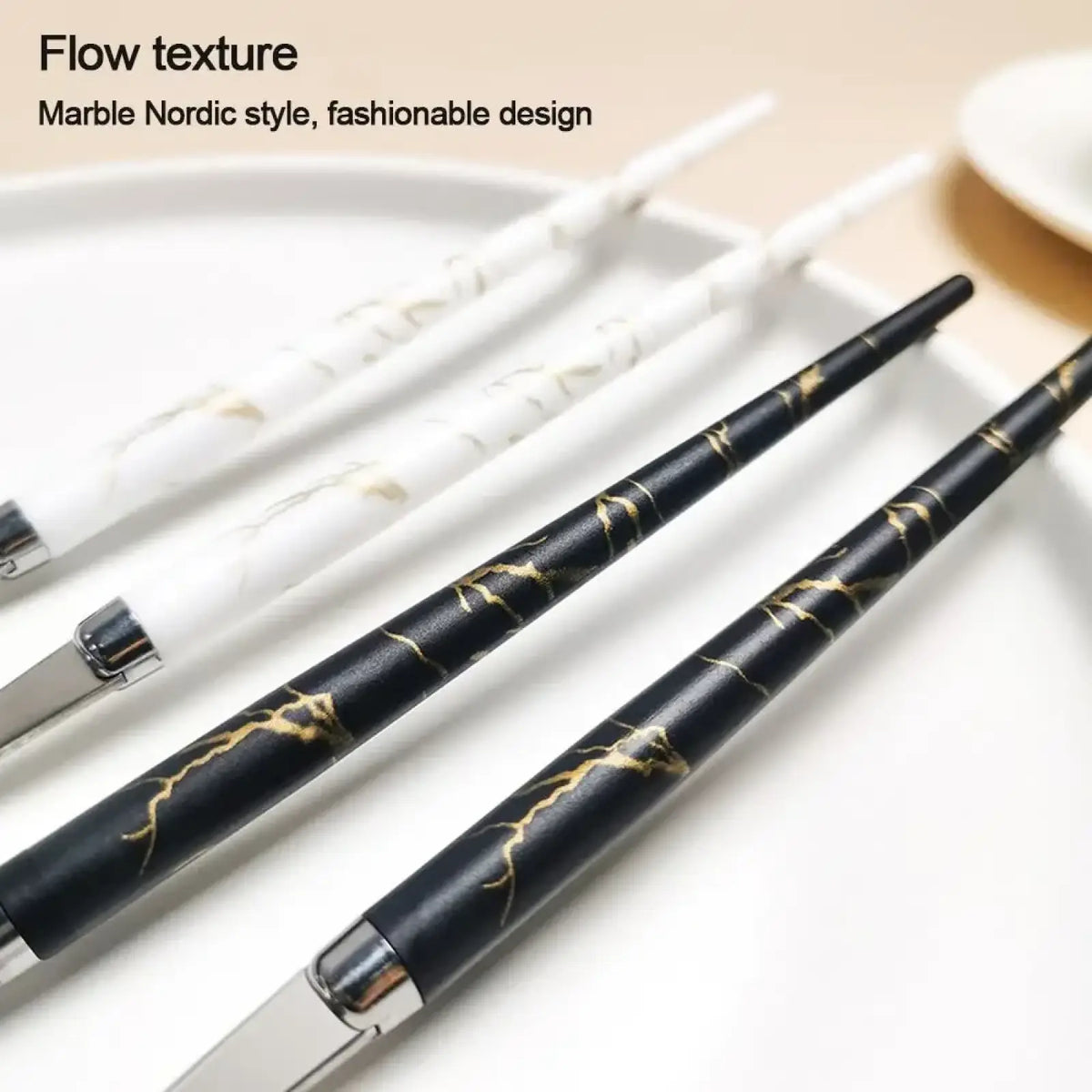 Elegant black and gold marble-patterned portable stainless steel cutlery set pens with sleek metallic accents