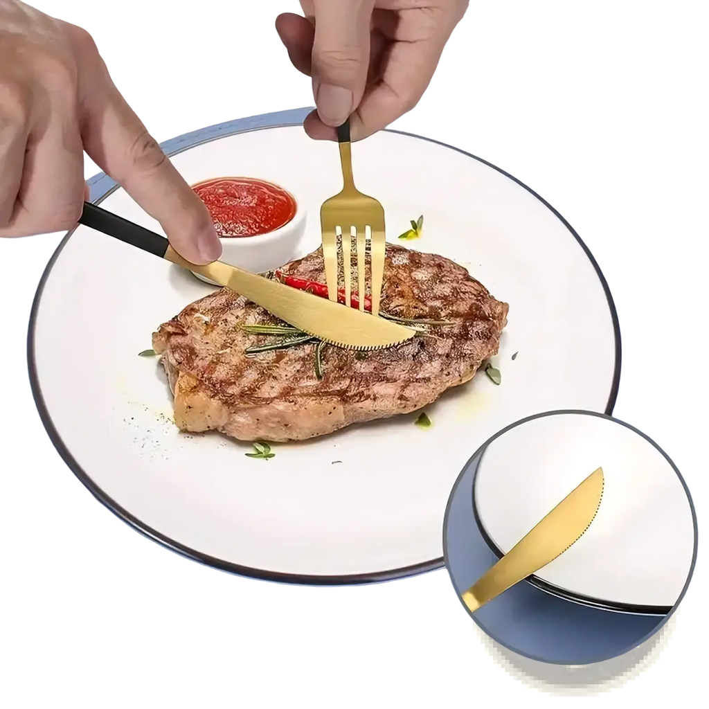 Portable stainless steel cutlery set with gold-finished blades and black handles used to serve grilled meat