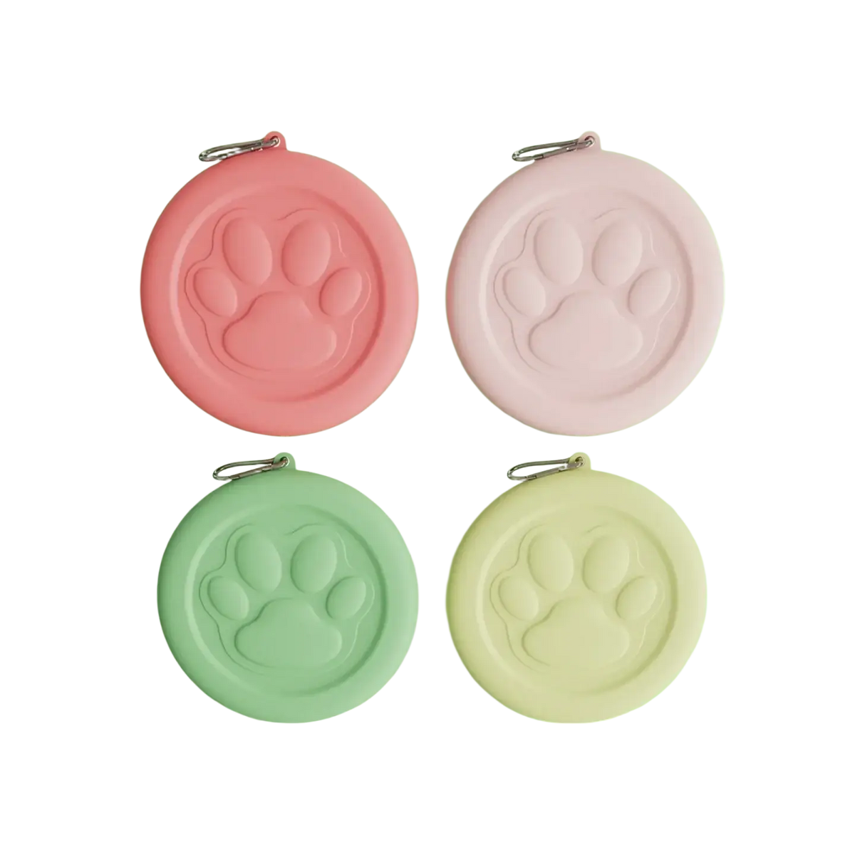 Portable travel dog bowl with treat compartment featuring pastel-colored silicone paw print keychains in pink mint and cream