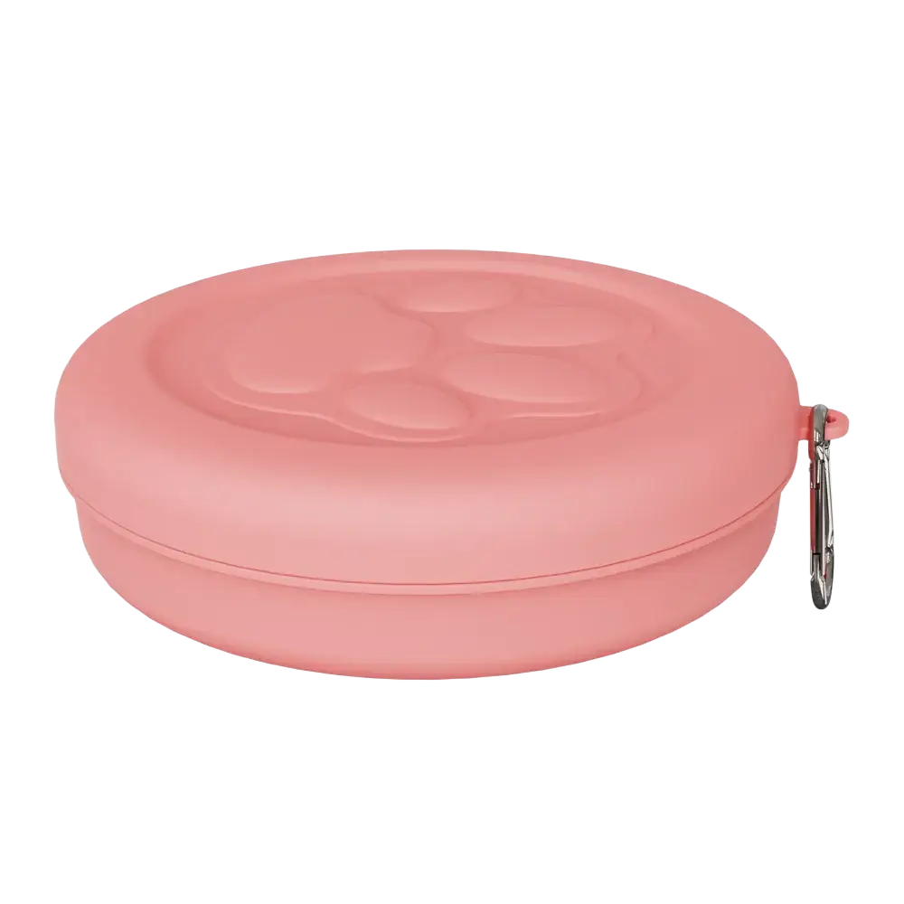 Portable travel dog bowl with treat compartment featuring a pink silicone leash case with raised paw print and silver carabiner clip