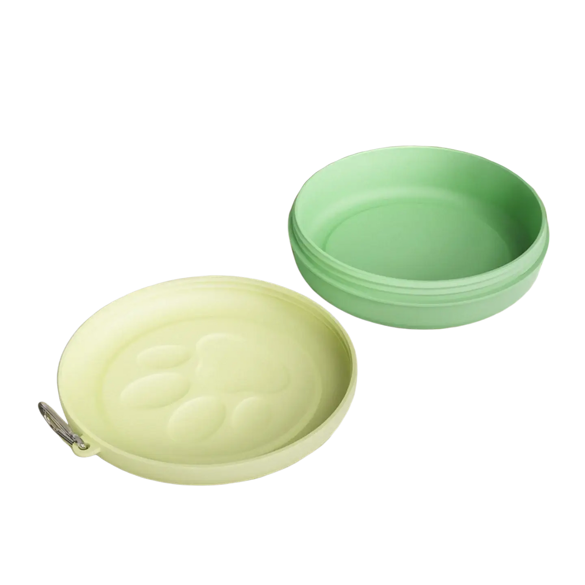 A soft pastel green silicone portable travel dog bowl with matching lid featuring embossed paw print and metal clasp