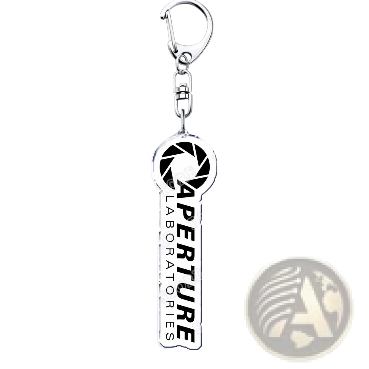 Silver acrylic key-shaped keychain with black aperture laboratories logo and bold white lettering for portal gamers