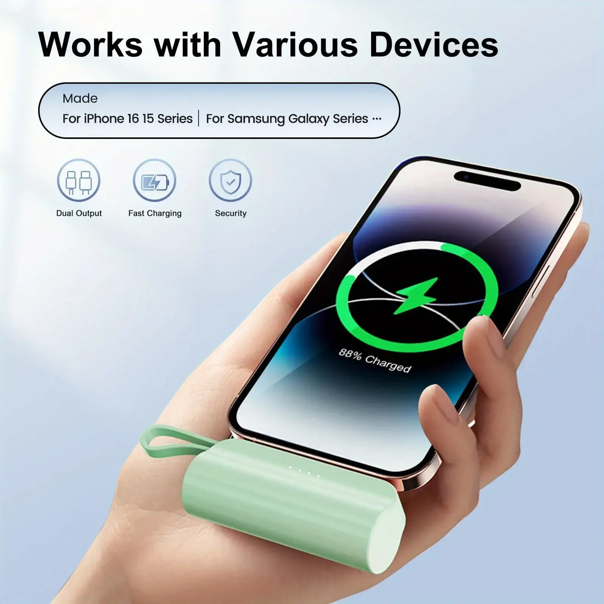 A sleek mint green cylindrical power bank 20000mah with dual usb c ports and a looped strap for mobile power portability