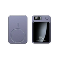 A sleek matte purple power bank with a circular magnetic wireless quick charge pad and digital display showing 100% charge