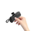 Black iphone mount power bank with sleek minimalist design and built-in quick charge port for portable use