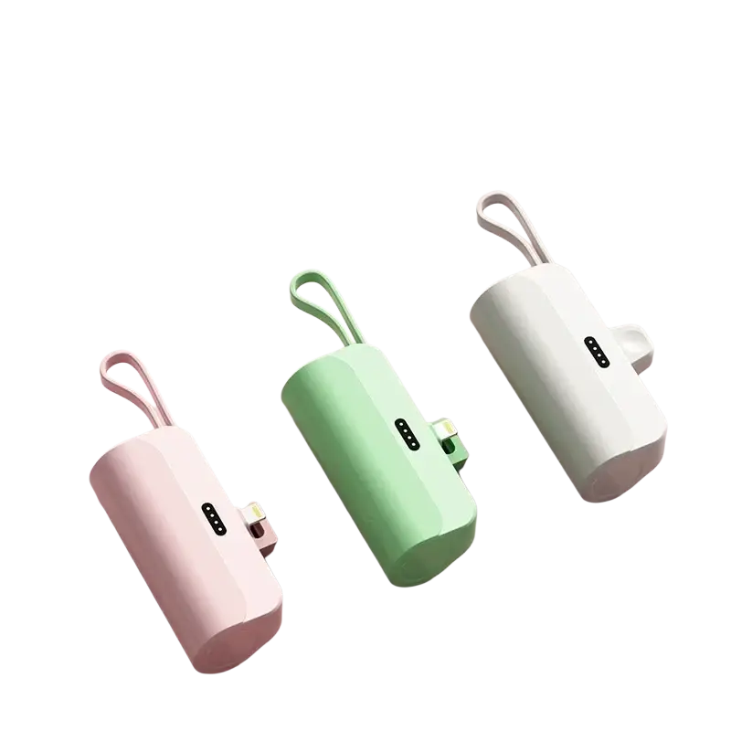 Pastel-colored cylindrical power bank quick charge portable mini charger with usb-c port and integrated wrist strap