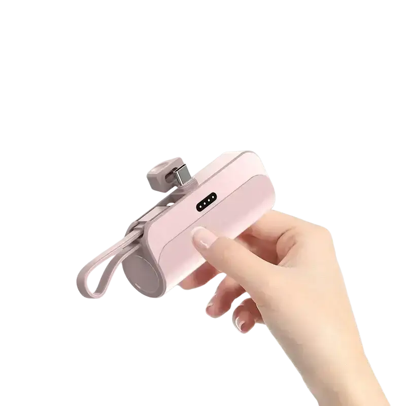 Pink portable mini power bank with quick charge feature, integrated usb-c cable, and wrist strap for easy carrying