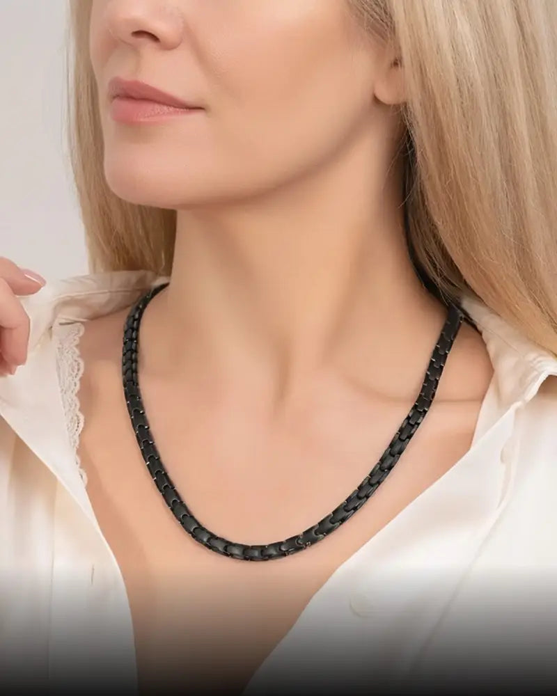 Black titanium braided chain necklace with neodymium magnets worn for magnetic therapy around the neck