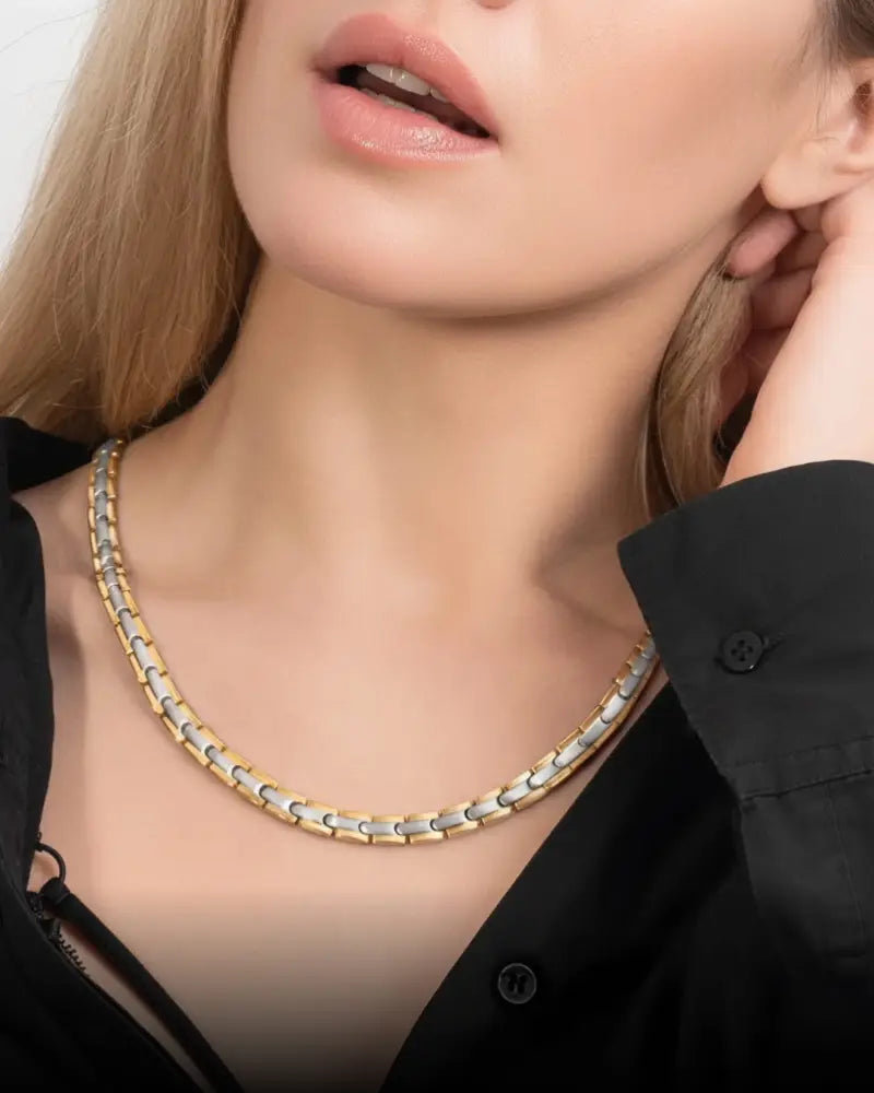 Two-tone titanium magnetic therapy link necklace with sleek interlocking gold and silver chain design