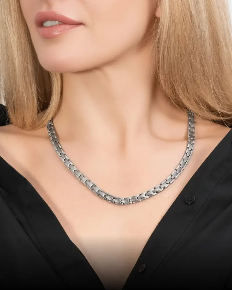 Silver titanium magnetic therapy necklace with 55 magnets and interlocking silver-toned chain links
