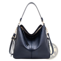 Black leather hobo bag with gold-tone hardware and tassel zipper pull, premium crossbody design