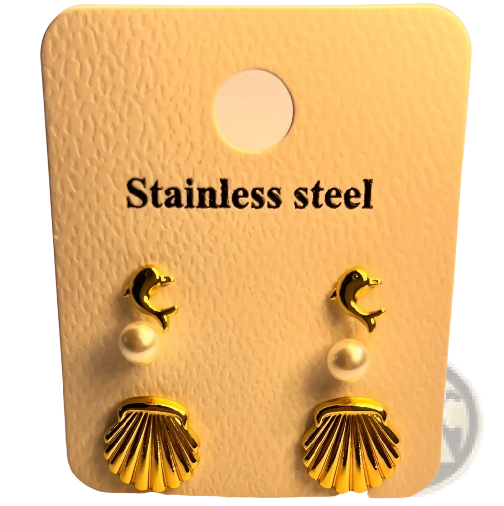 Premium gold plated dolphin and shell stud earrings with pearl accents displayed on a stainless steel card