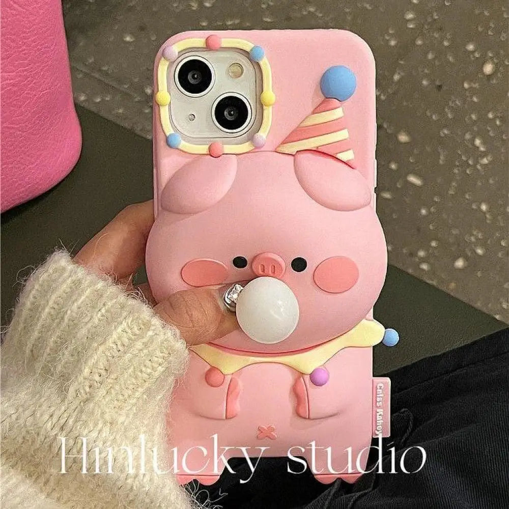Pink silicone pig-shaped 3d cartoon bubble popping phone case with party hat and colorful beads on back side