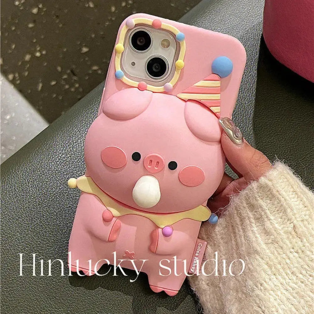 Pink silicone 3d pig cartoon bubble popping phone case with clown hat and candy-colored stress relief design